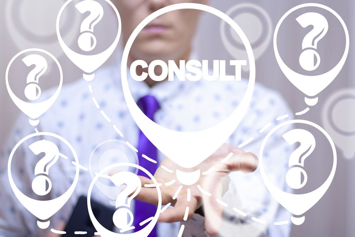 Consultant uses on a virtual screen of the future and sees the word: CONSULT. Consulting business financial strategy concept. Consult and quuestions.
